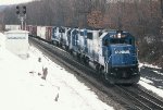 CR 6771 leads CR's PIOI east out of the passing siding on a snowy day